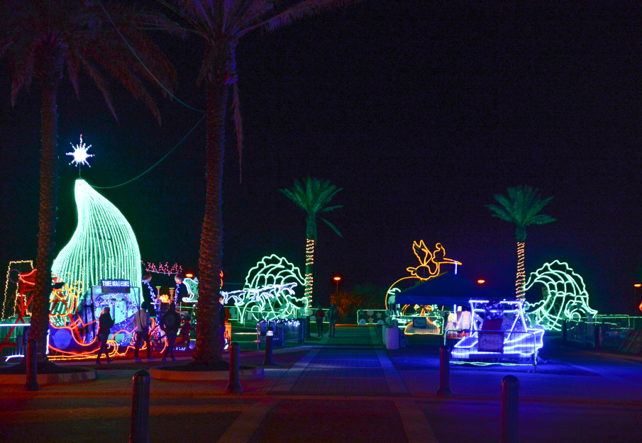 Holiday light displays lit up at nighttime 