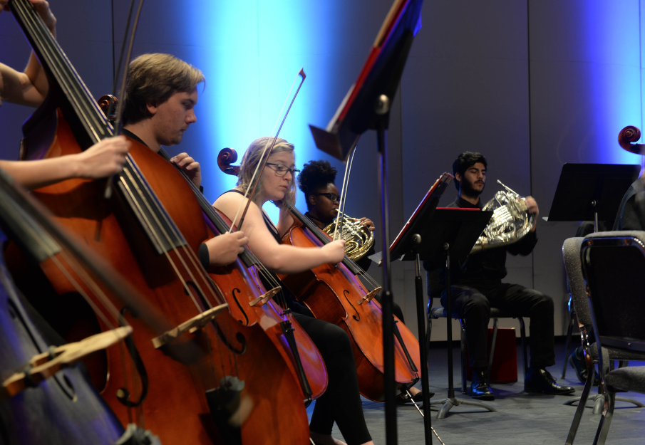 Students playing cello in the Fine Arts Center