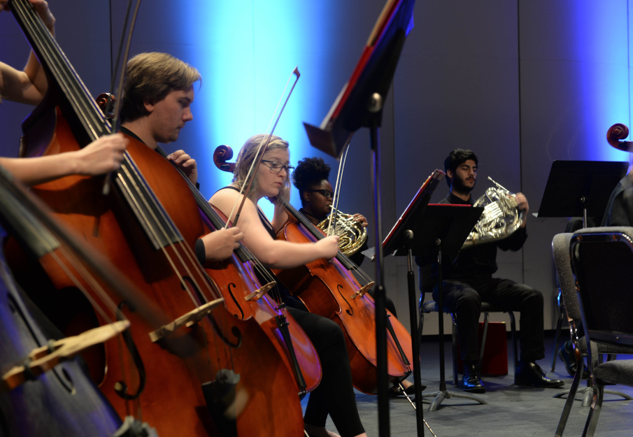 School of Music concert with a group of people playing the cello