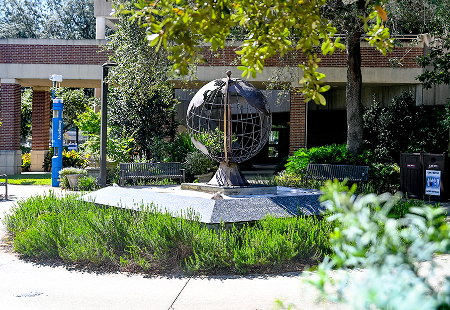 Metal globe sculpture outside the social sciences building