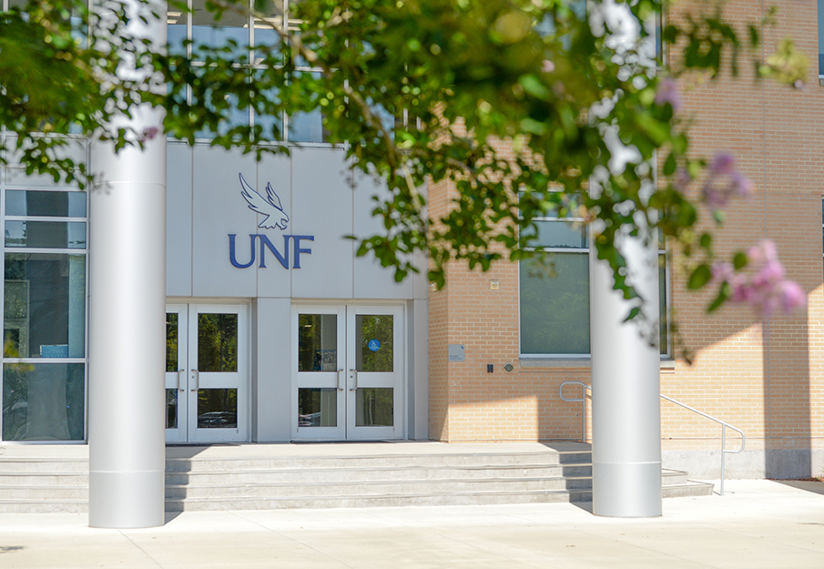 Campus building with a UNF sign out front