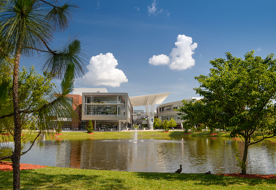 Outside view of the Student Union building and the small lake out front