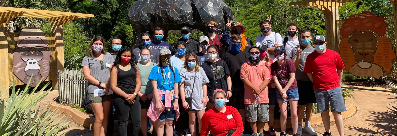 Large group of OCT students at the Jacksonville Zoo standing together for a photo