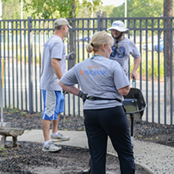 volunteers working outside on the preschool playground