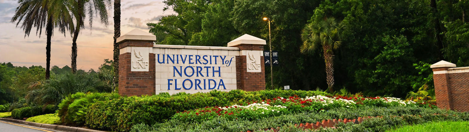 main university of north florida entrance sign at sunrise