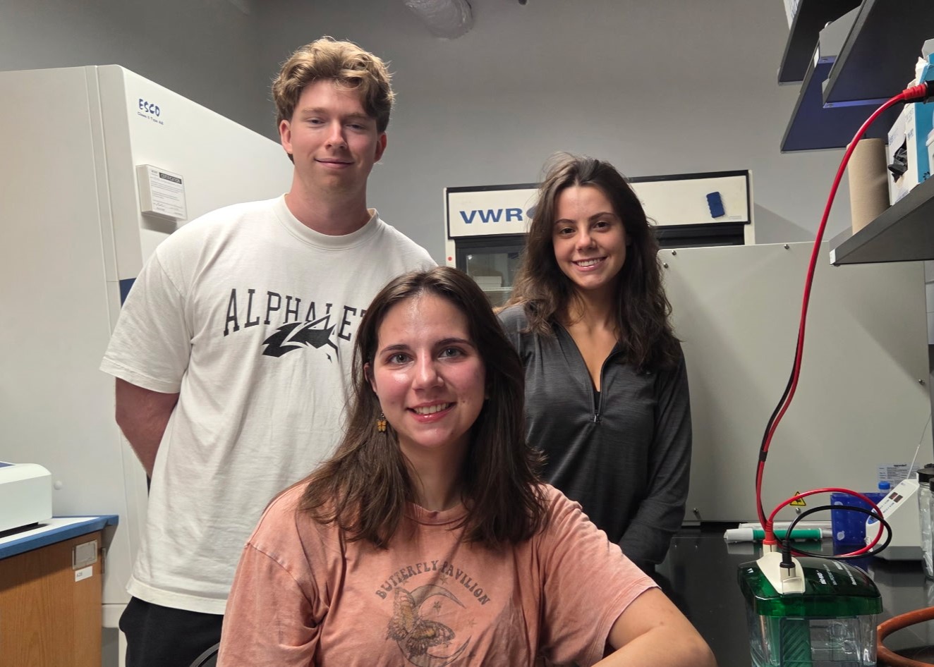 Erina, Lauren, and Zach smiling and posing in the lab. 