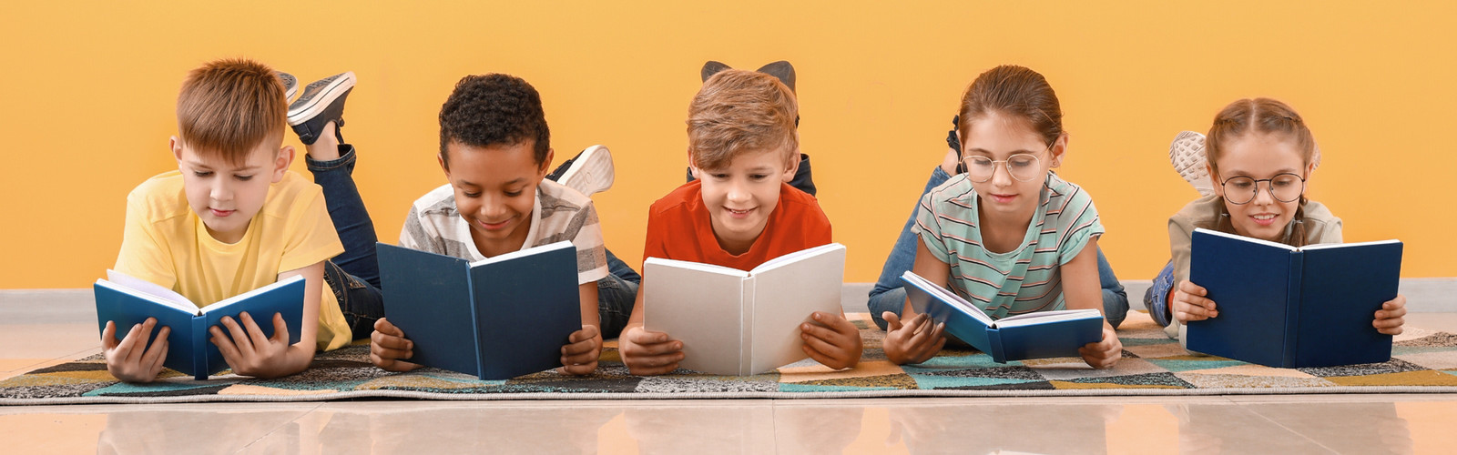 Group of children reading books