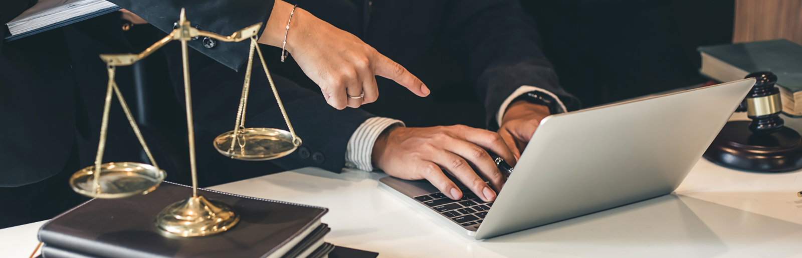 lawyers on laptop in legal setting