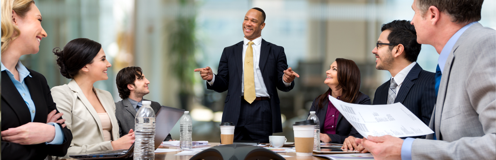 business meeting with people smiling at the speaker