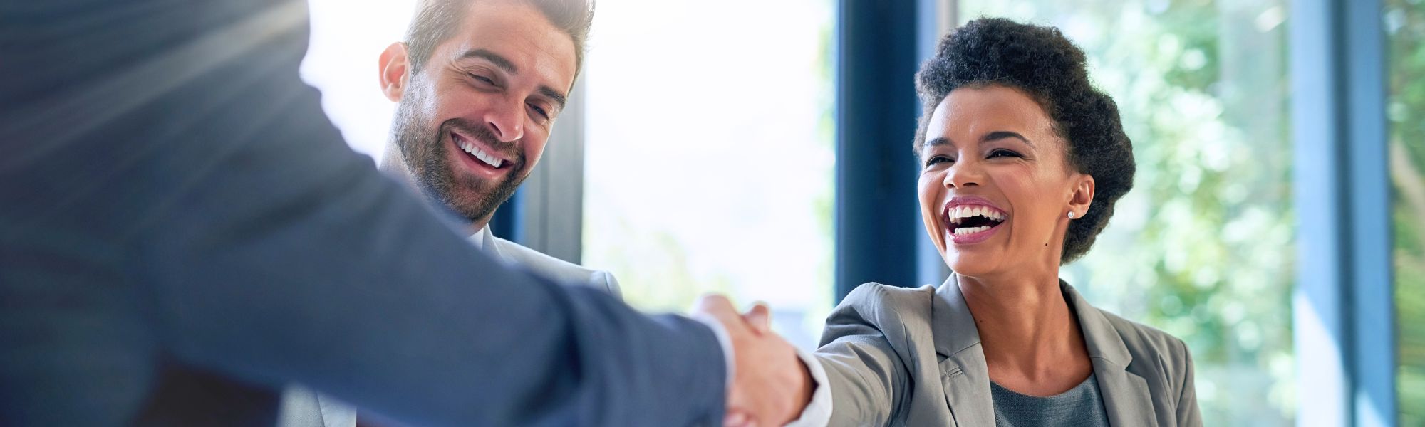 Smiling woman shaking hands