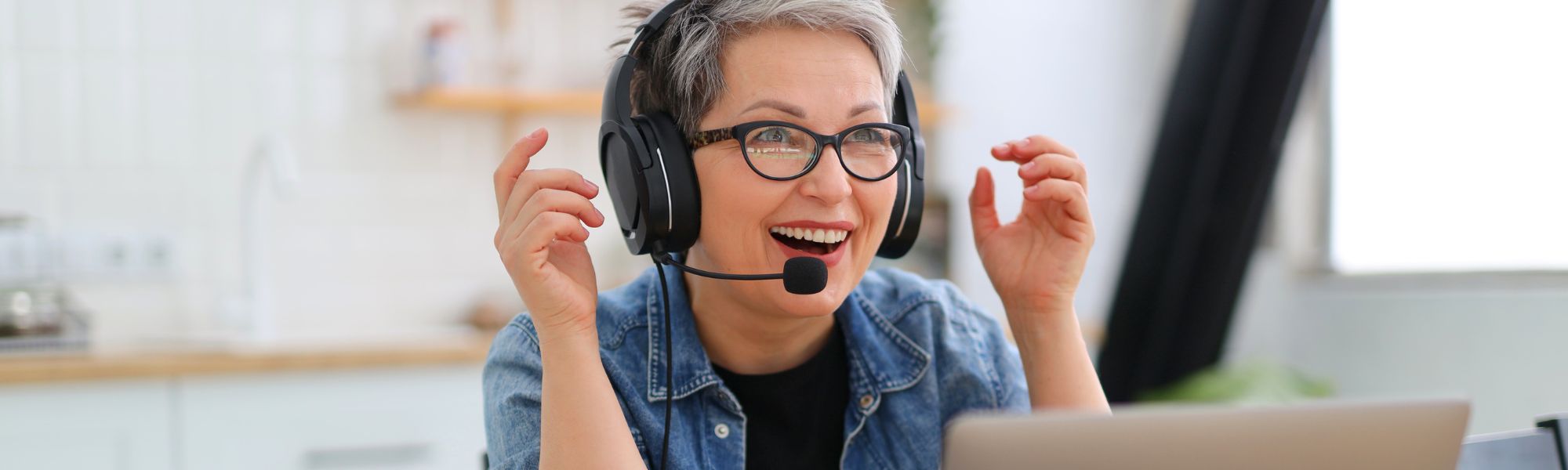 Woman with a headset talking to people online