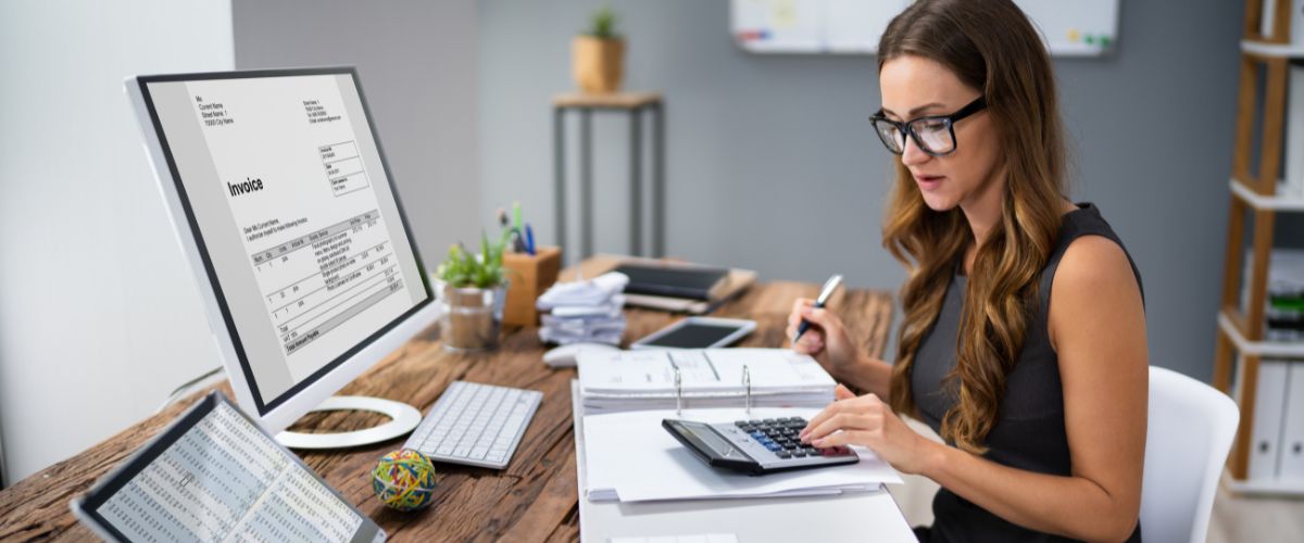 Working an accountant with calculator