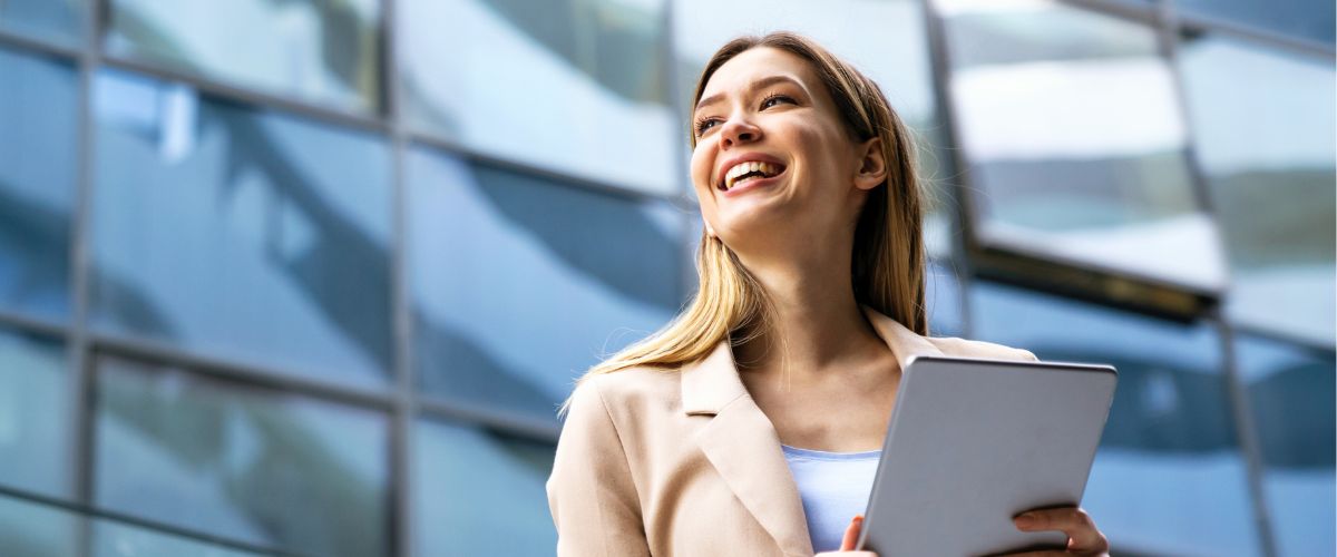 Smiling brand manager with a tablet