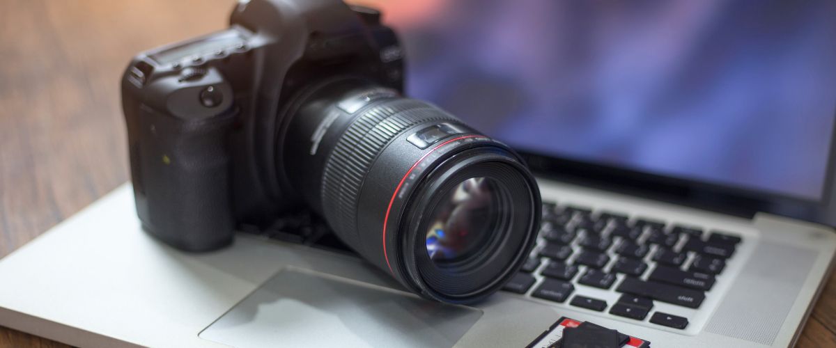 Digital camera and SD cards on a laptop