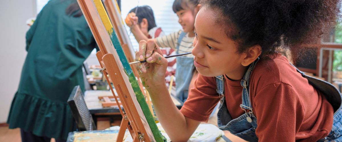 Girl enjoying watercolor drawing