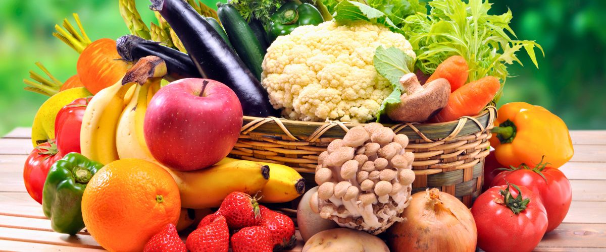 A basket full of fresh vegetables and fruits