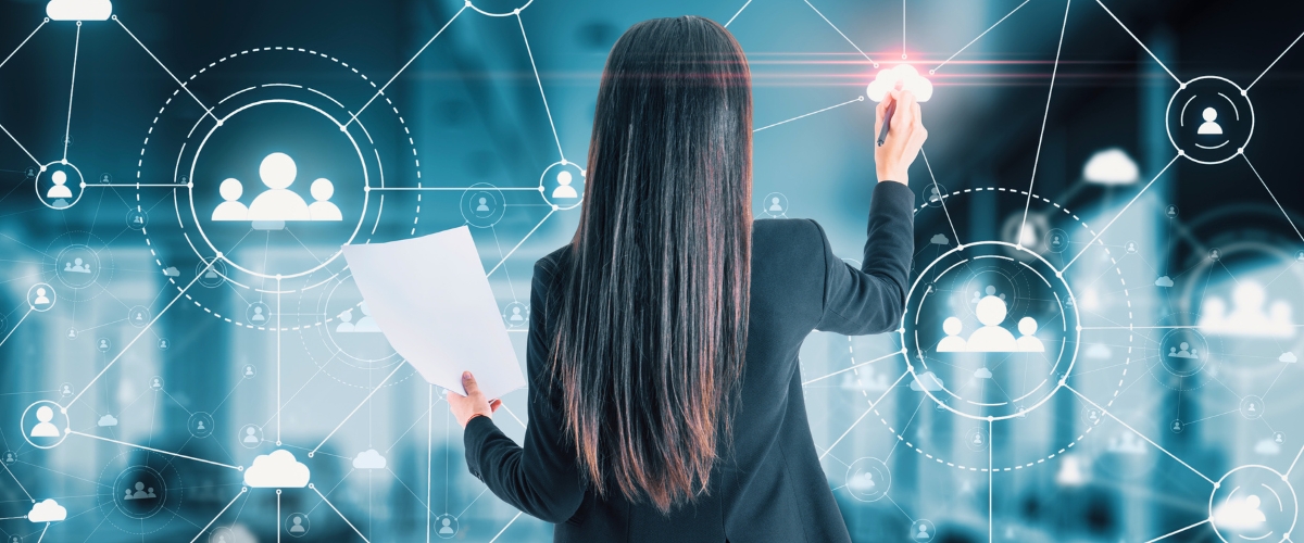 Businesswoman drawing a people network on virtual screen