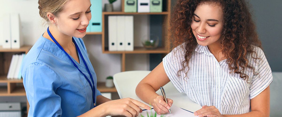 Administrative assistant working with nurse