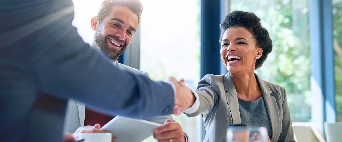 Smiling woman handshaking