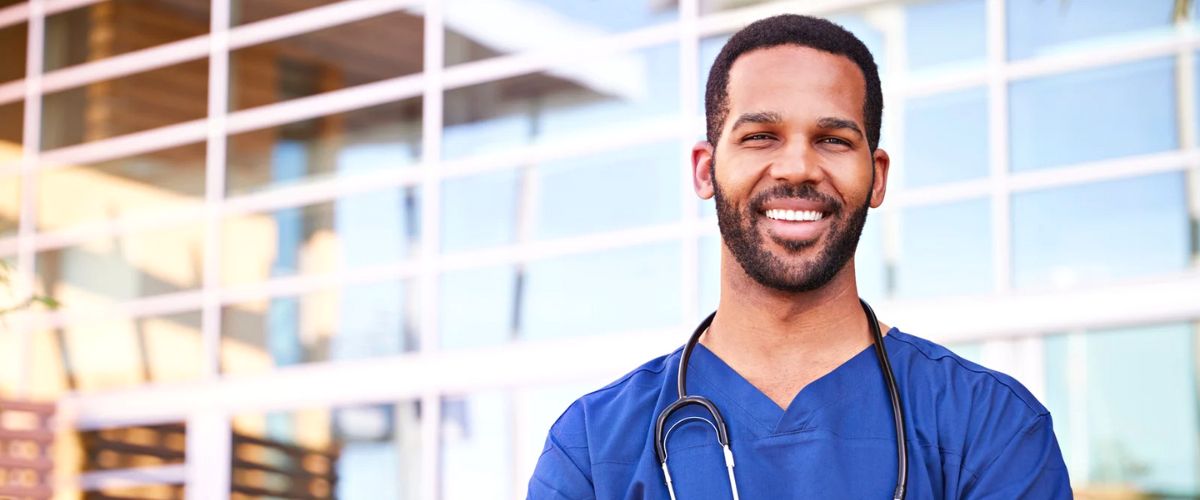 Smiling nurse with blue scrubs