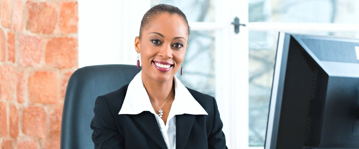 Friendly paralegal working at her desk