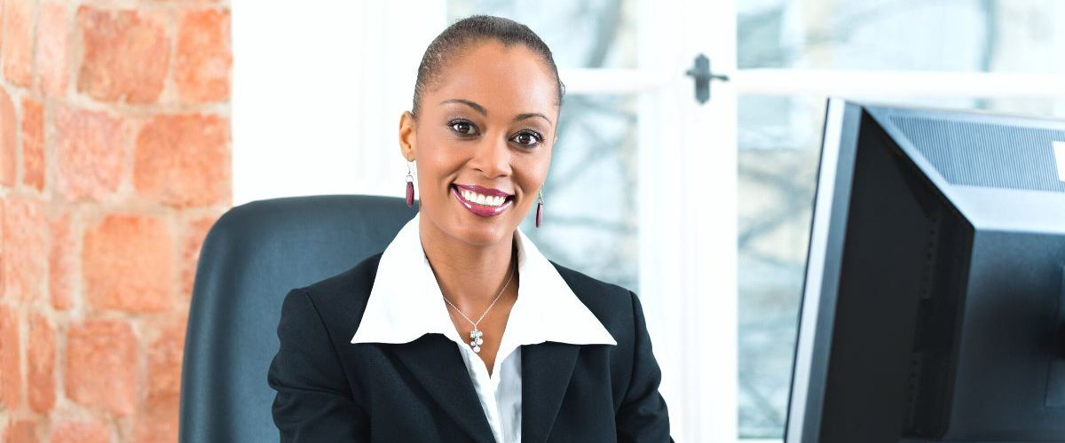 Smiling paralegal at her desk