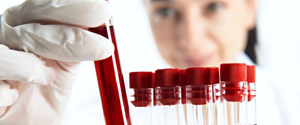 Woman collecting blood at a lab