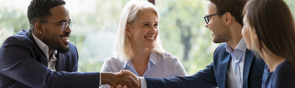Smiling business people shaking hands