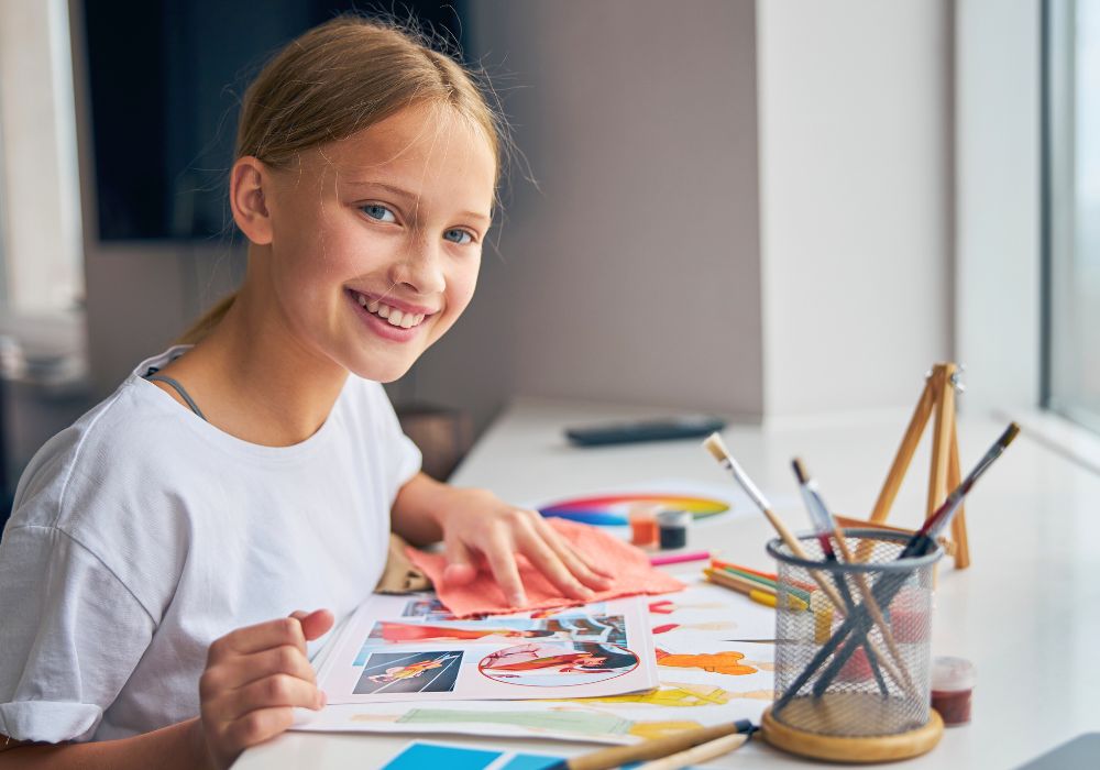 Smiling girl studying about fashions 