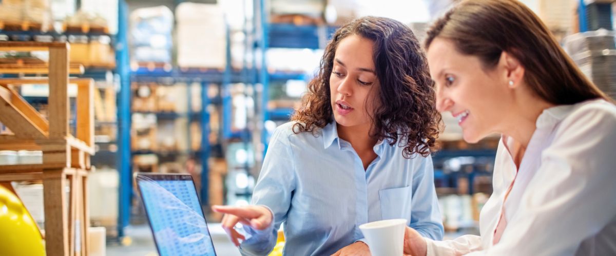 Warehouse manager checking a spreadsheet