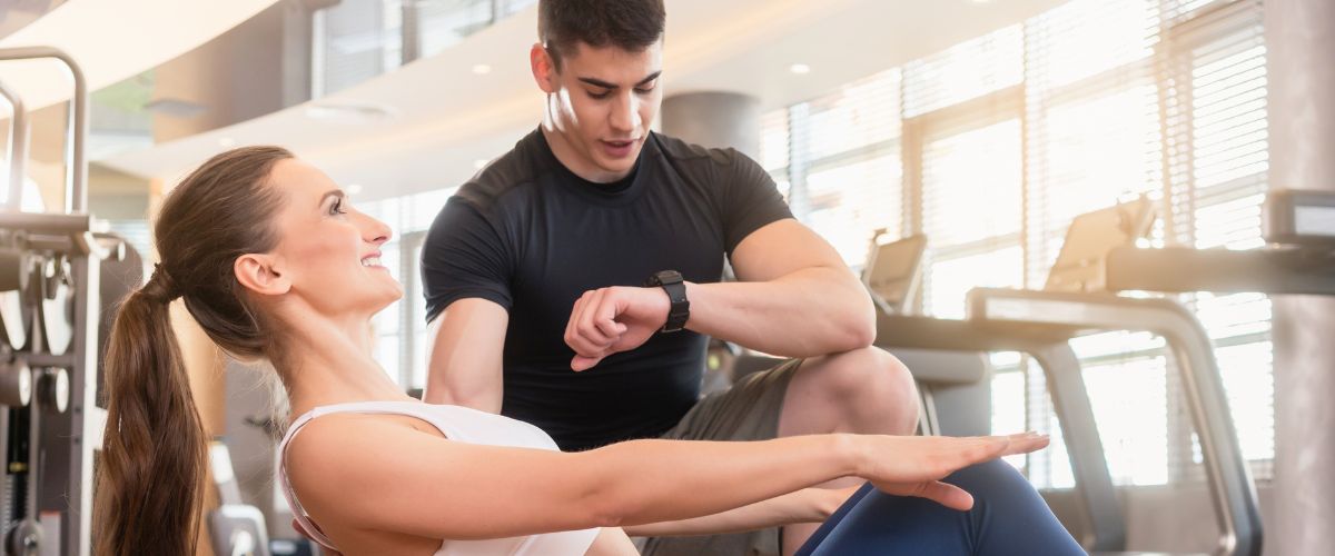 Male personal trainer with a client