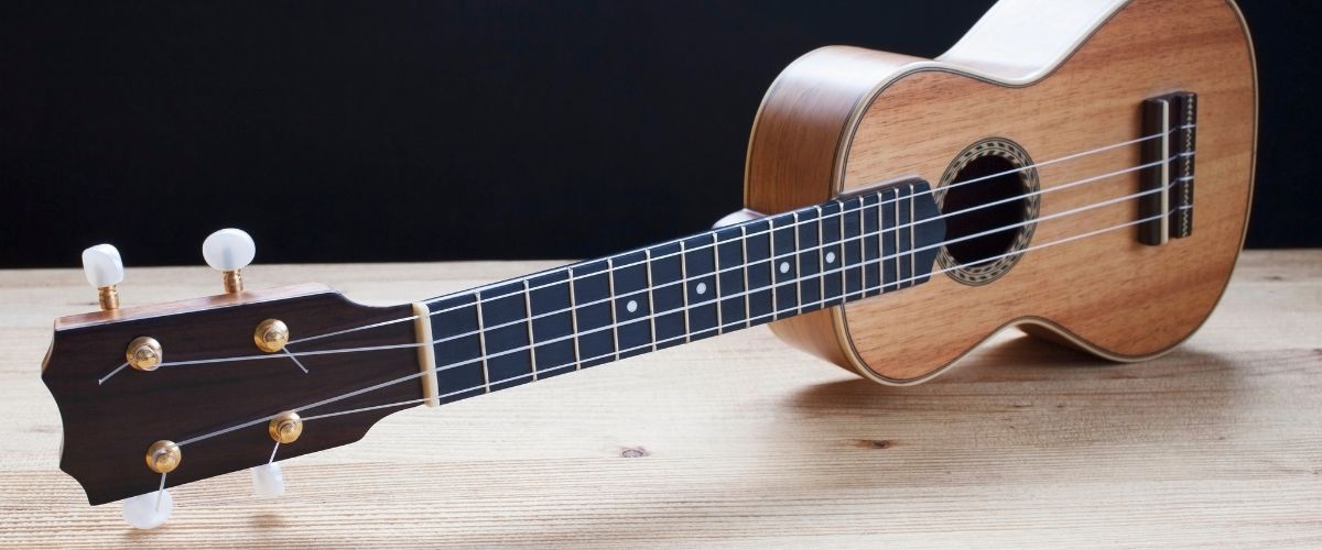 A close-up of a wooden ukulele