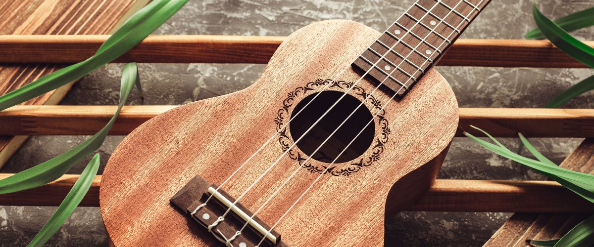 A brand new ukulele on floor