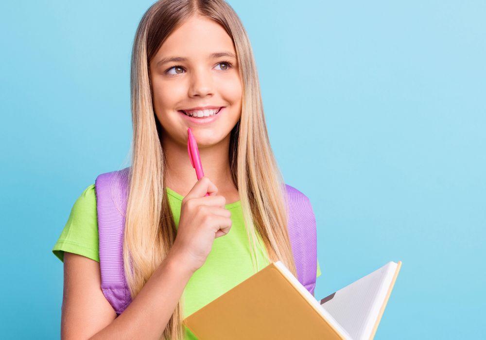Smiling teenage girl creating a story