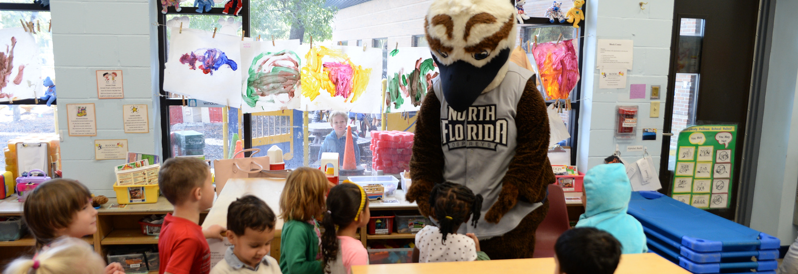 Ozzie in the students classroom giving them all high-fives