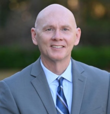 A smiling headshot of Vice President Scott Bennett