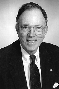 A smiling black and white headshot of interim president Fretwell. 