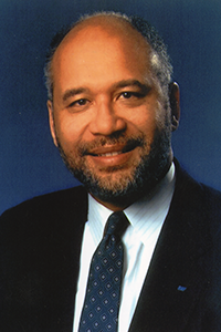 A smiling headshot of President Herbert 