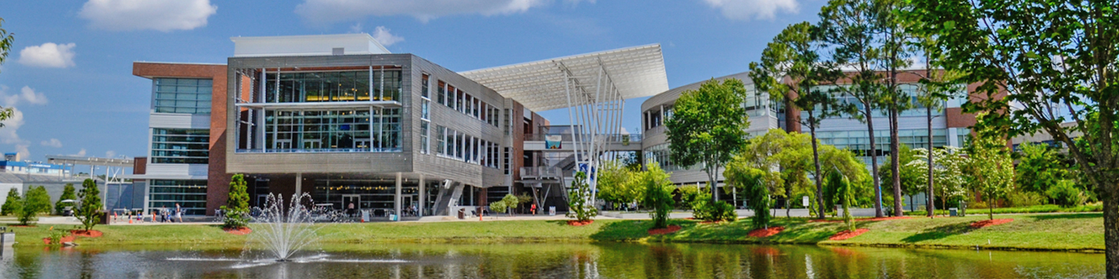 Student Union building with lake and fountain in front