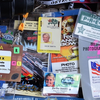 Dede Smith press pass collection on table