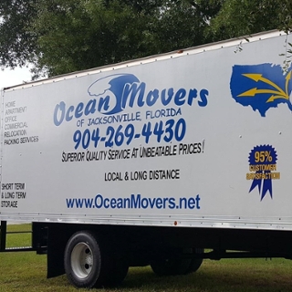 Ocean Movers logo on the side of a truck with their website www.OceanMovers.net featured