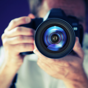 person holding a professional camera