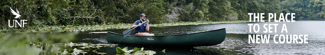 Man kayaking on a lake with text reading "The Place to Set a New Course"