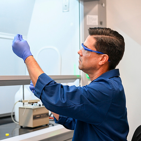 UNF researcher working with equipment