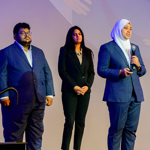 Student researchers speaking at a panel