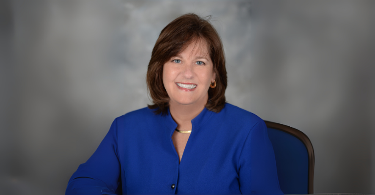 headshot of consultant in a blue jacket