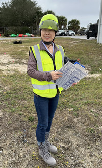 picture of women in a hard hat and safety vest