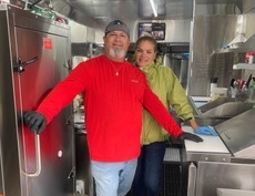 L Sandwiches owners Eddie and Lourdes Wagaman in the kitchen