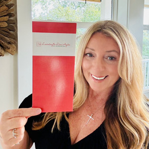 picture of client holding her brochure