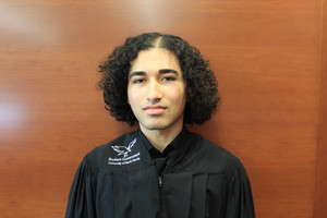 Headshot of Associate Justice Kareem Barakzoy